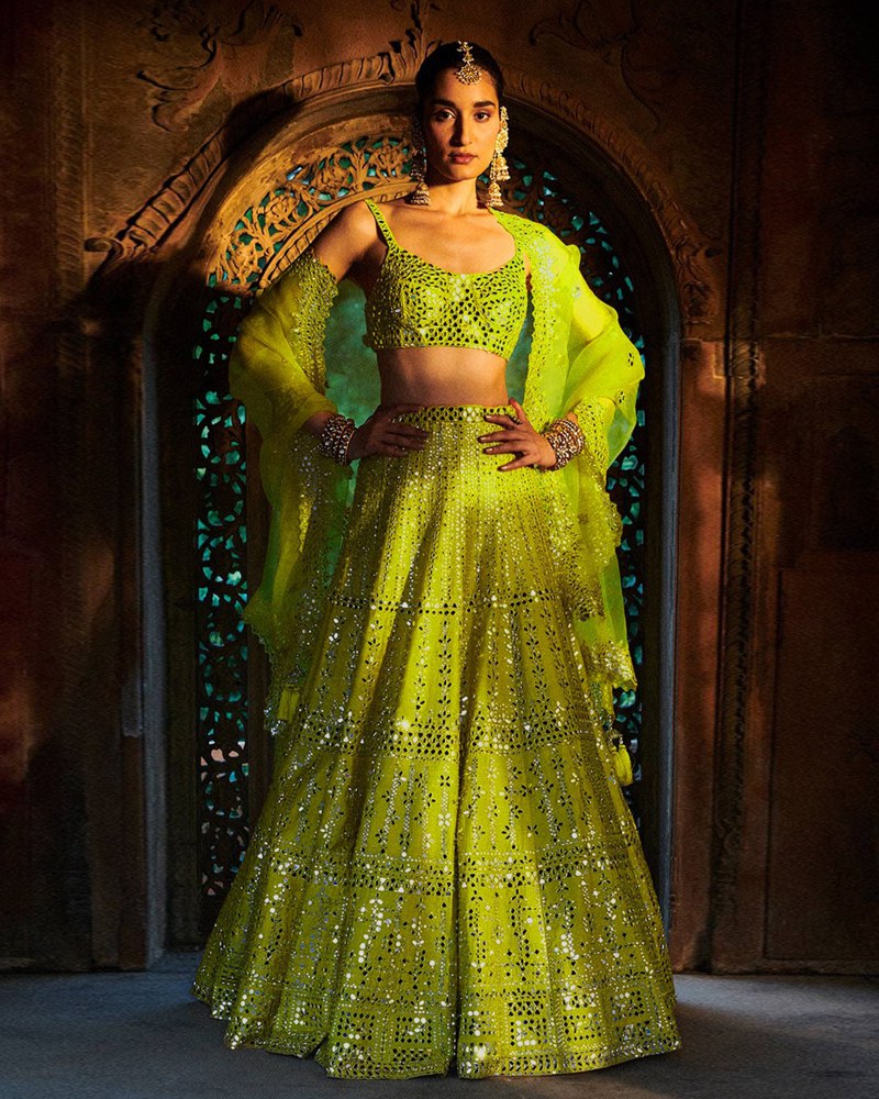 Enchanting Green Lehenga Choli adorned with Exquisite Thread-Sequence Embroidery and Foil Mirror Work
