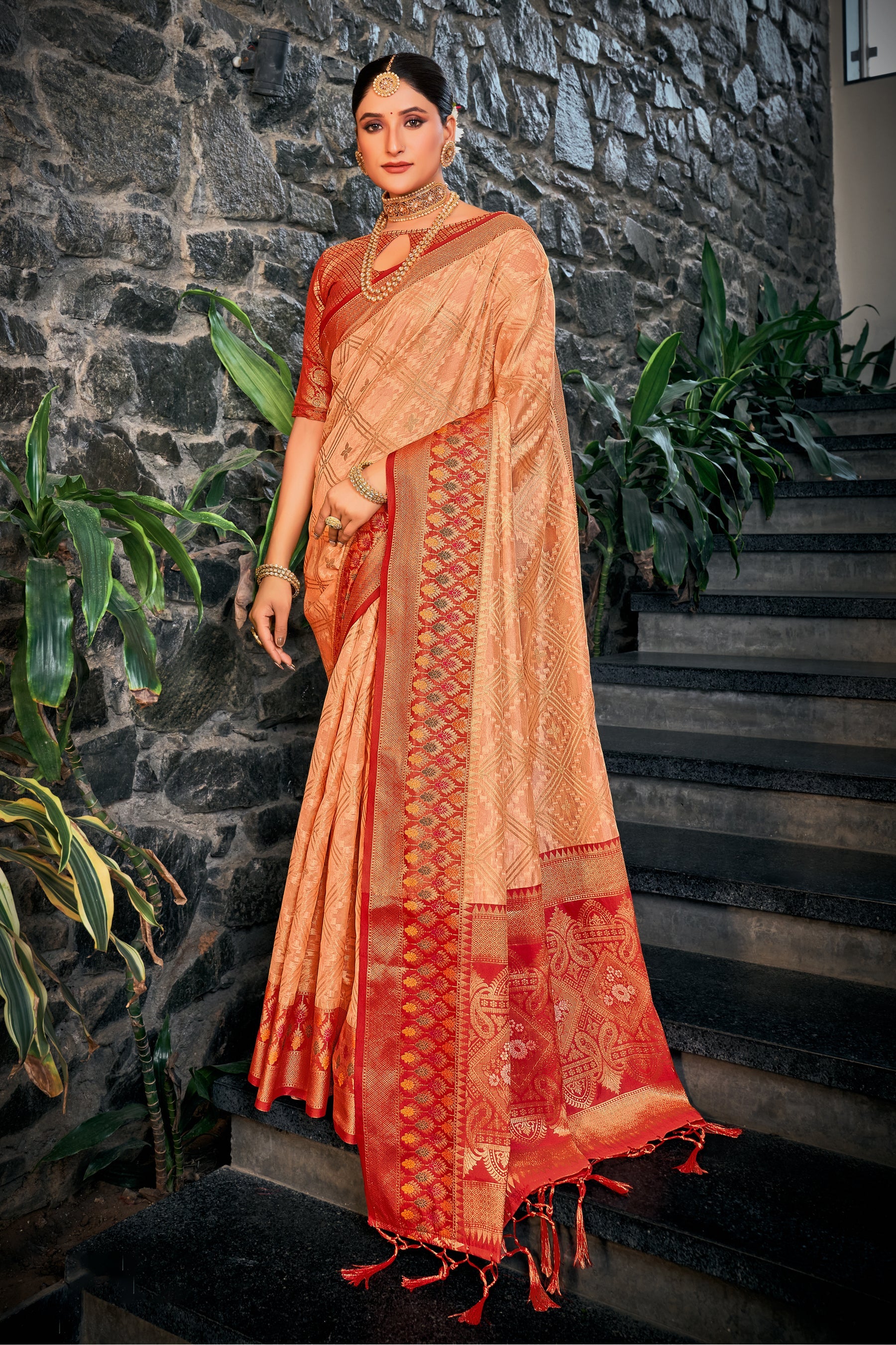 Enchanting Light Orange Saree: Elegant Embroidery, Pallu Tassels - Perfect for Parties and Weddings.